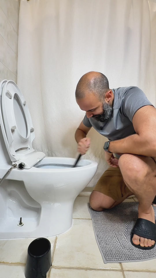 Adding a BLITZ tablet to a toilet tank for blue water